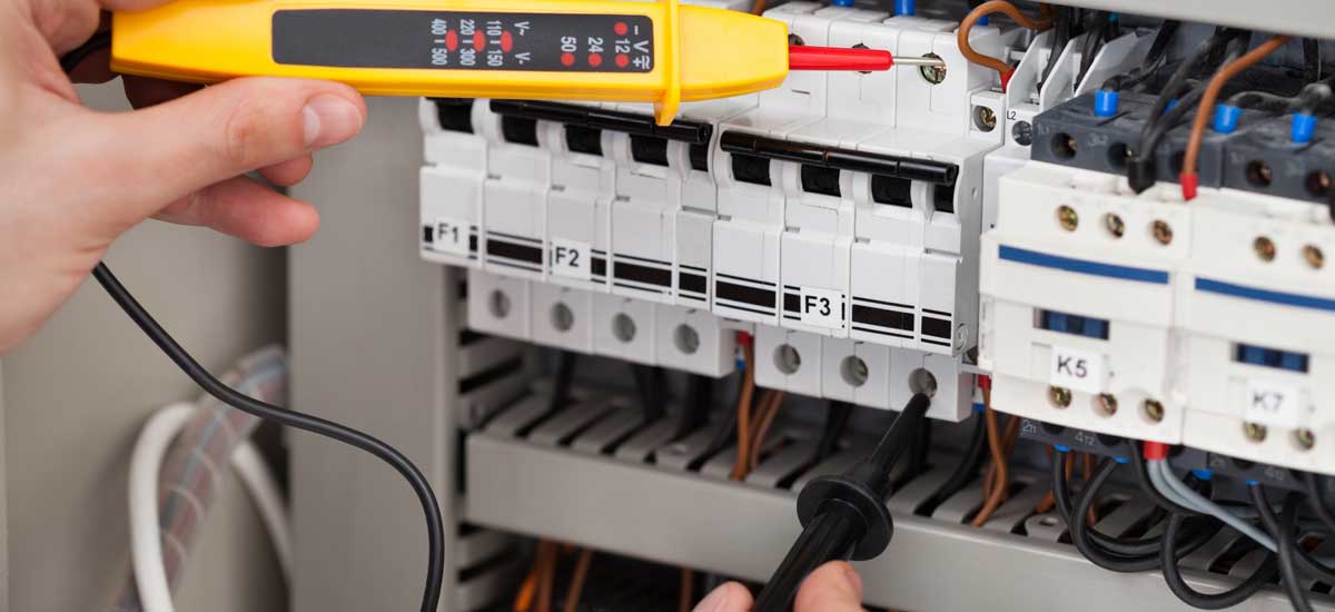 Electrician working on fuse board upgrades